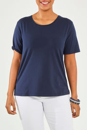 Model Noli wearing size 14 of The Keepers Tee in colour Darknavy (Blue), from the front, cropped image