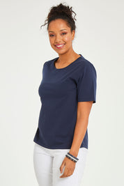Model Noli wearing size 14 of The Keepers Tee in colour Darknavy (Blue), from the front, cropped image