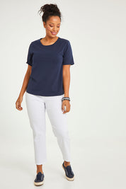 Model Noli wearing size 14 of The Keepers Tee in colour Darknavy (Blue), from the front, showing the whole outfit