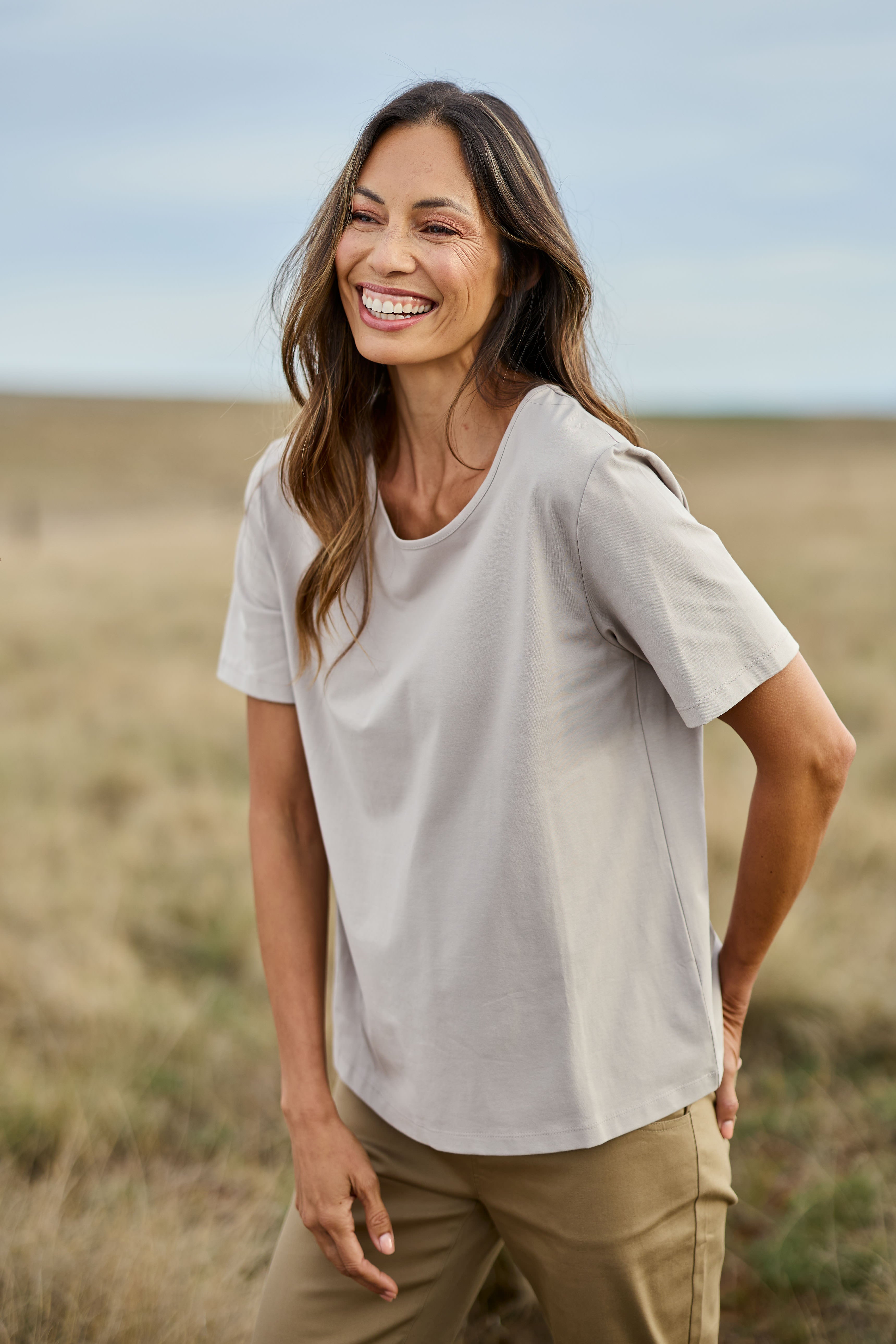 Model Amanda wearing size 10 of The Keepers Tee in colour Latte, from the front, showing the whole outfit