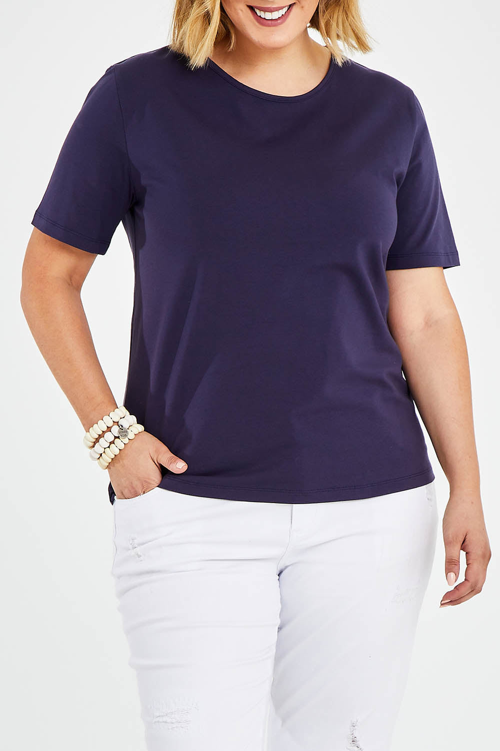 Model Jess wearing size 14 of The Keepers Tee in colour Navy (Blue), from the front, cropped image