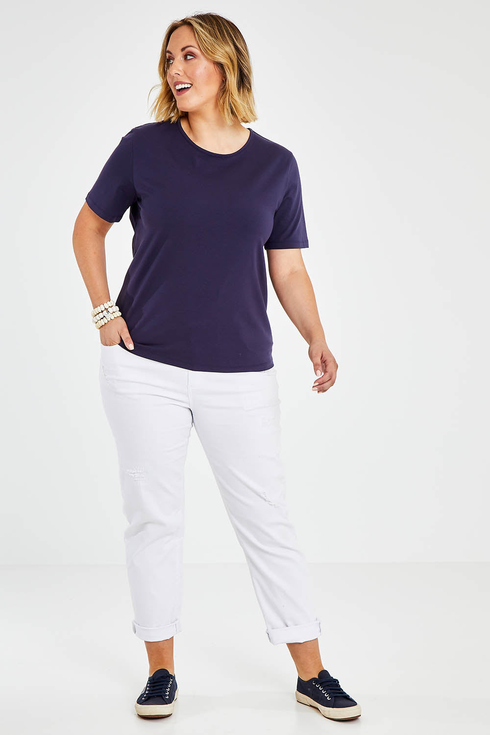Model Jess wearing size 14 of The Keepers Tee in colour Navy (Blue), from the front, showing the whole outfit
