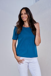 Model Amanda wearing size 10 of The Keepers Tee in colour Opal (Blue), from the front, showing the whole outfit