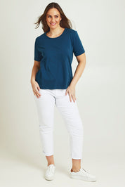 Model Jane wearing size 14 of The Keepers Tee in colour Opal (Blue), from the front, showing the whole outfit