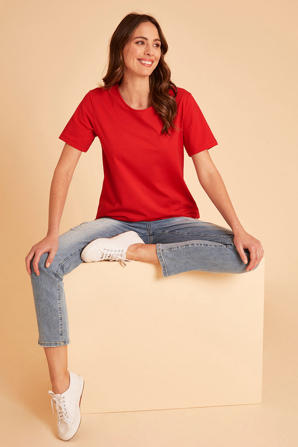 Model Madeline wearing size 10 of The Keepers Tee in colour Red (Red), from the front, showing the whole outfit