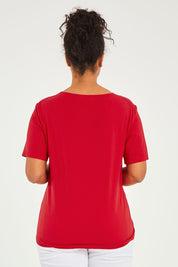 Model Noli wearing size 14 of The Keepers Tee in colour Red (Red), from the back
