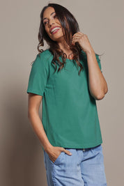 Model Amanda wearing size 10 of The Keepers Tee in colour Seagreen (Green), from the front, cropped image