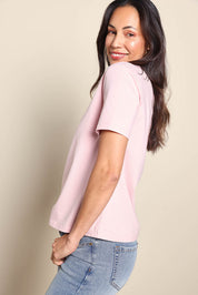 Model Amandam wearing size 10 of the The Keepers Tee – Softpink in colour Softpink, from an angle