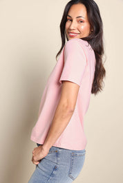Model Amandam wearing size 10 of the The Keepers Cotton Tee – Softpink in colour Softpink, from an angle