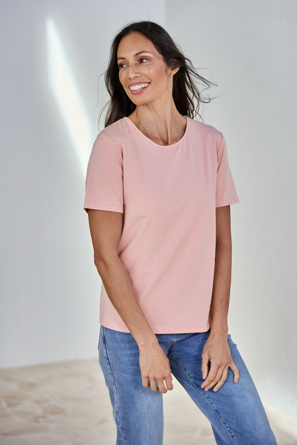 Model Amandam wearing size 10 of the The Keepers Cotton Tee – Softpink in colour Softpink, in a cropped view