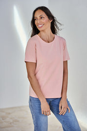 Model Amandam wearing size 10 of the The Keepers Cotton Tee – Softpink in colour Softpink, in a cropped view