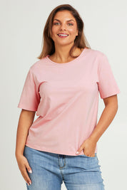 Model Moniquep wearing size 14 of the The Keepers Cotton Tee – Softpink in colour Softpink, in a cropped view