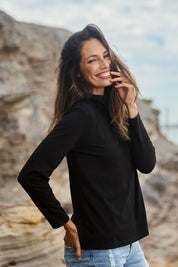 Model Amanda wearing size 10 of The Keepers Skivvy in colour Black (Black), from the front, showing the whole outfit