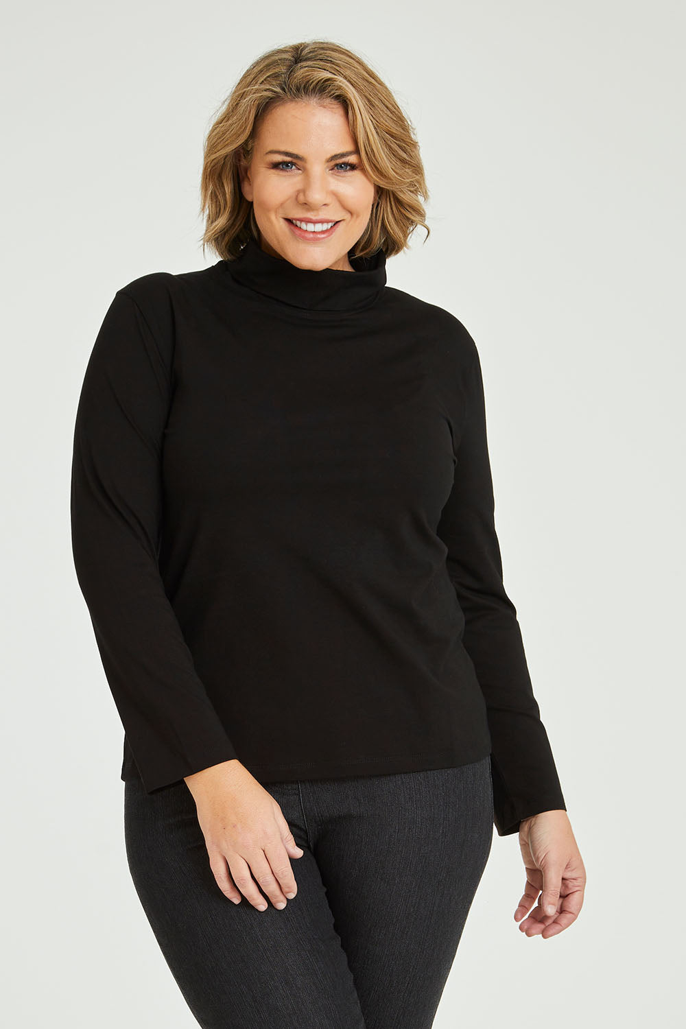 Model Fiona wearing size 16 of The Keepers Skivvy in colour Black (Black), from the front, cropped image
