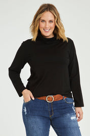 Model Jess wearing size 14 of The Keepers Skivvy in colour Black (Black), from the front, cropped image