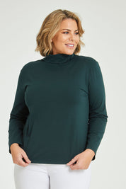 Model Fiona wearing size 16 of The Keepers Skivvy in colour Pinegreen (Green), from the front, cropped image