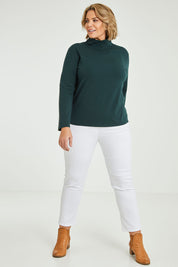 Model Fiona wearing size 16 of The Keepers Skivvy in colour Pinegreen (Green), from the front, showing the whole outfit