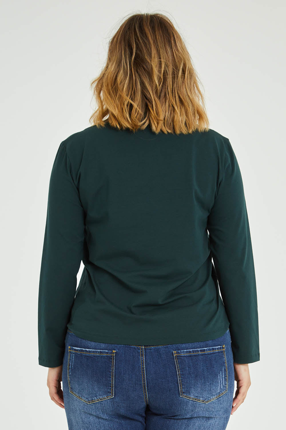 Model Jess wearing size 14 of The Keepers Skivvy in colour Pinegreen (Green), from the back