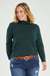 Model Jess wearing size 14 of The Keepers Skivvy in colour Pinegreen (Green), from the front, cropped image
