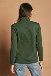 Model Madeline wearing size 10 of The Keepers Skivvy in colour Pinegreen (Green), from the back