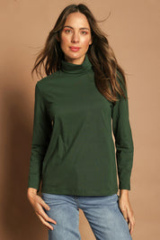 Model Madeline wearing size 10 of The Keepers Skivvy in colour Pinegreen (Green), from the front, showing the whole outfit