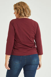 Model Fiona wearing size 16 of The Keepers 3/4 Sleeve Tee in colour Burgundy (Purple), from the back