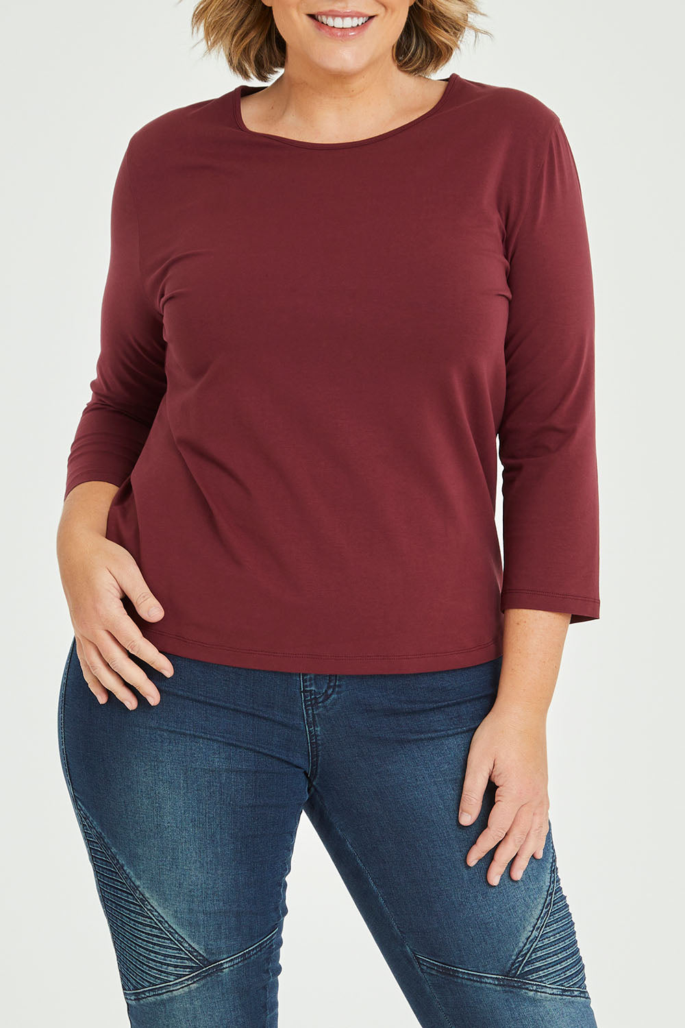 Model Fiona wearing size 16 of The Keepers 3/4 Sleeve Tee in colour Burgundy (Purple), from the front, cropped image