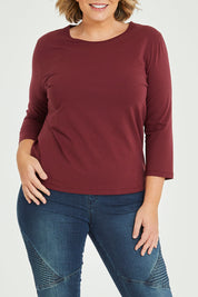 Model Fiona wearing size 16 of The Keepers 3/4 Sleeve Tee in colour Burgundy (Purple), from the front, cropped image