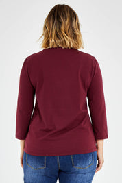 Model Jess wearing size 14 of The Keepers 3/4 Sleeve Tee in colour Burgundy (Purple), from the back