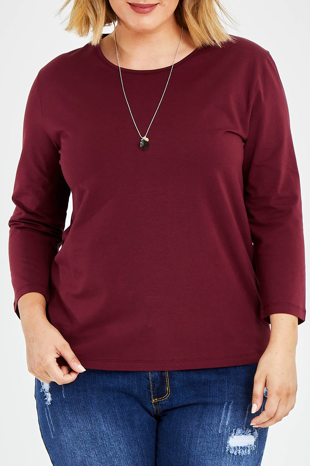 Model Jess wearing size 14 of The Keepers 3/4 Sleeve Tee in colour Burgundy (Purple), from the front, cropped image