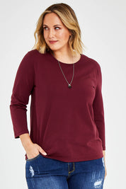Model Jess wearing size 14 of The Keepers 3/4 Sleeve Tee in colour Burgundy (Purple), from the front, cropped image
