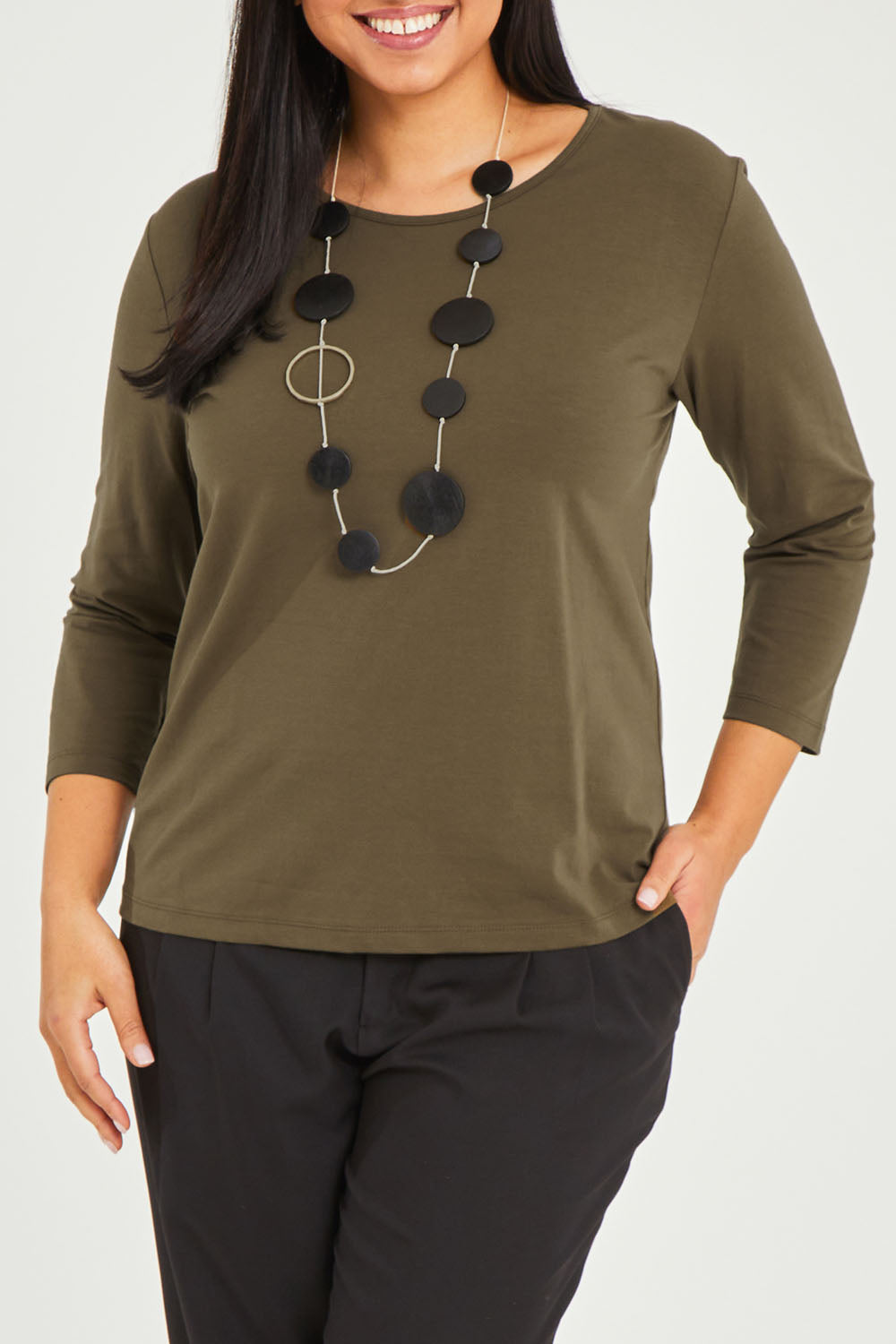 Model Terri-Leigh wearing size 14 of The Keepers 3/4 Sleeve Tee in colour Khaki (Green), from the front, cropped image