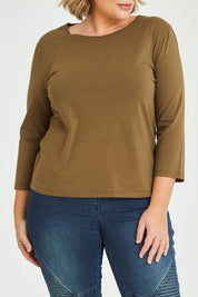 Model Fiona wearing size 16 of The Keepers 3/4 Sleeve Tee in colour Olive (Green), from the front, cropped image
