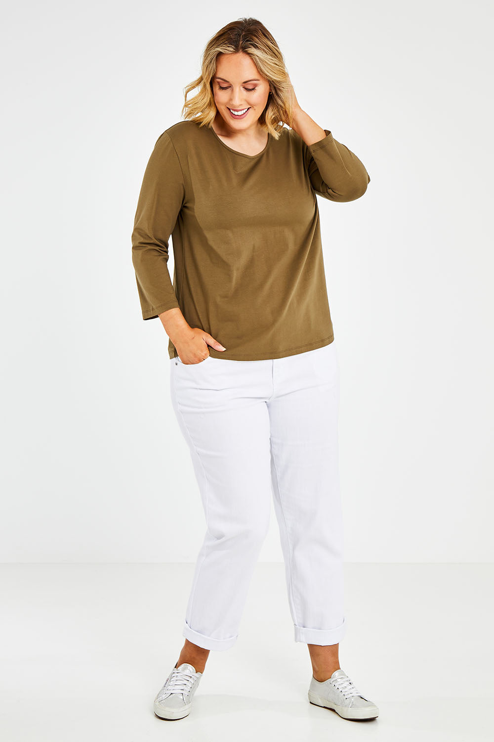 Model Jess wearing size 14 of The Keepers 3/4 Sleeve Tee in colour Olive (Green), from the front, showing the whole outfit