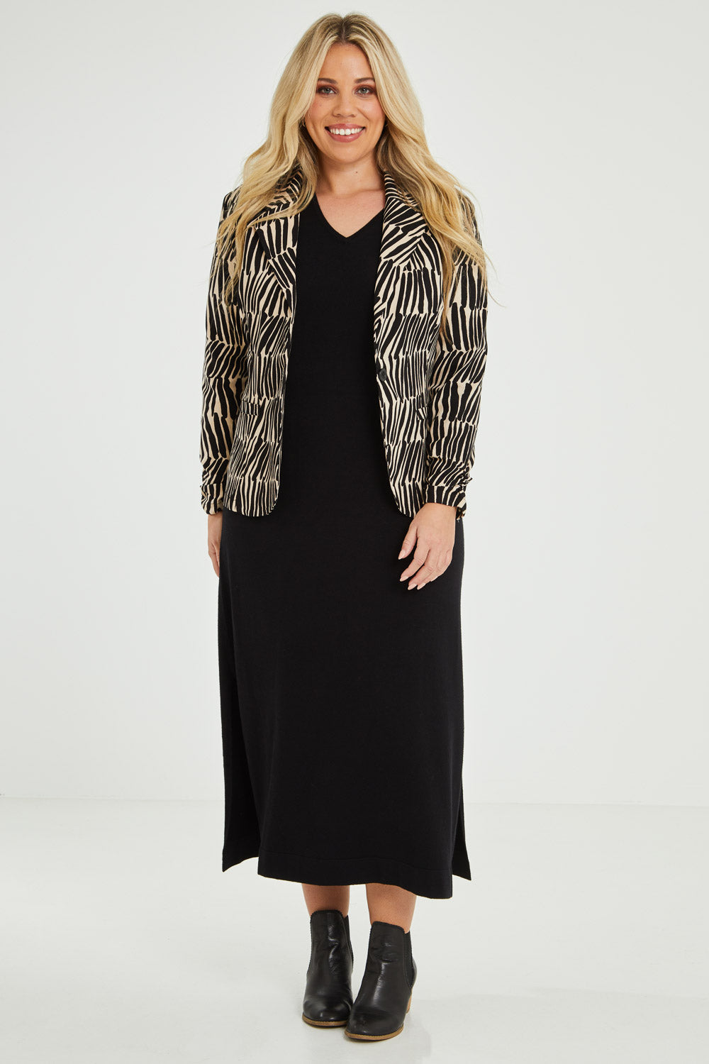 Model Katie wearing size 16 of The Everyday Printed Long Sleeve Blazer in colour Blackcamel (Black), from the front, showing the whole outfit