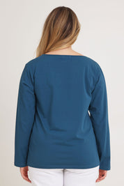 Model Chanel wearing size 16 of The Keepers Long Sleeve Tee in colour Opal (Blue), from the back
