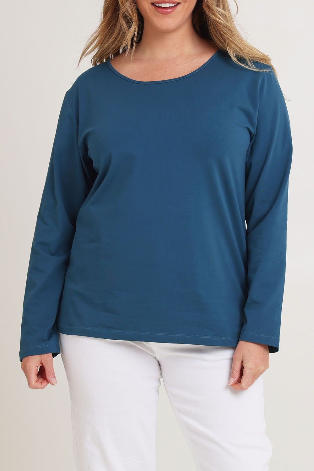Model Chanel wearing size 16 of The Keepers Long Sleeve Tee in colour Opal (Blue), from the front, cropped image
