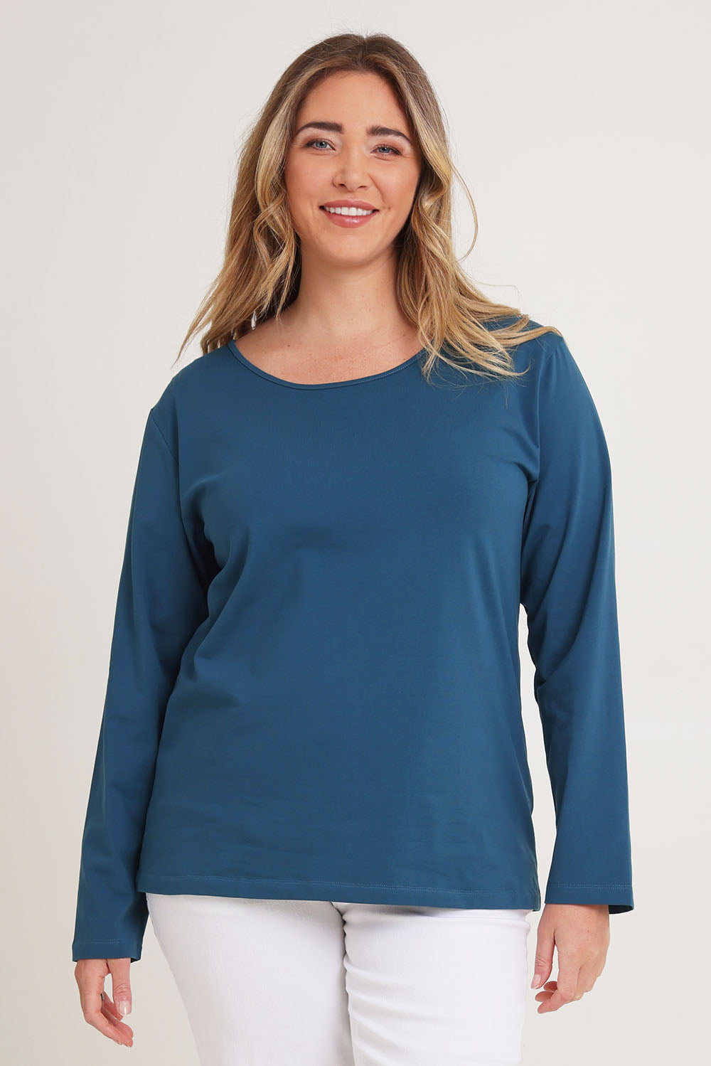 Model Chanel wearing size 16 of The Keepers Long Sleeve Tee in colour Opal (Blue), from the front, cropped image