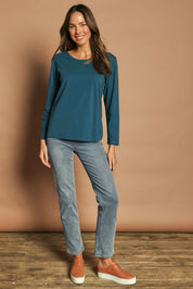 Model Madeline wearing size 10 of The Keepers Long Sleeve Tee in colour Opal (Blue), from the front, showing the whole outfit