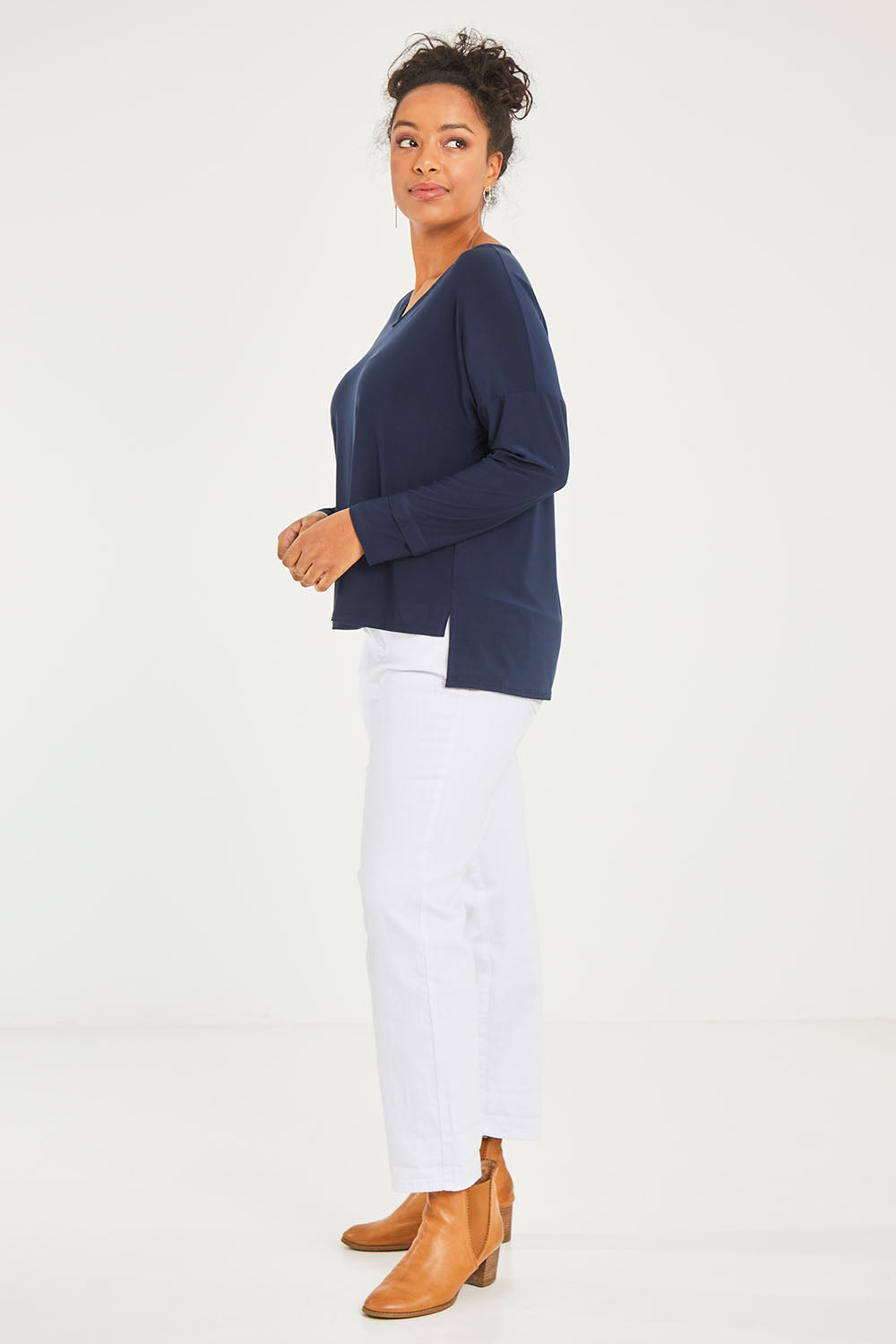 Model Noli wearing size 14 of The Recycled V Neck Double Cuff Top in colour Navy (Blue), from the front, showing the whole outfit
