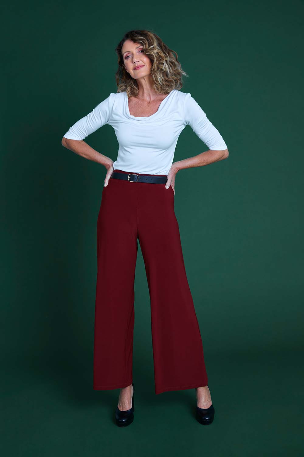 Model Emma wearing size 10 of The Recycled Wide Leg Pant in colour Terracotta, from the front, showing the whole outfit