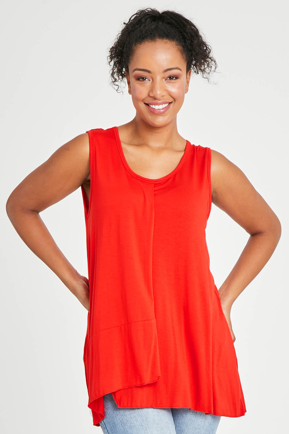 Model Noli wearing size 14 of The Long Overlay Tank in colour Red (Red), from the front, cropped image