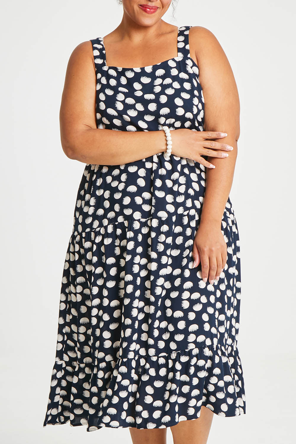 Model Alexis wearing size 16 of The Square Neck Layered Dress in colour Navyivory (Blue), from the front, cropped image