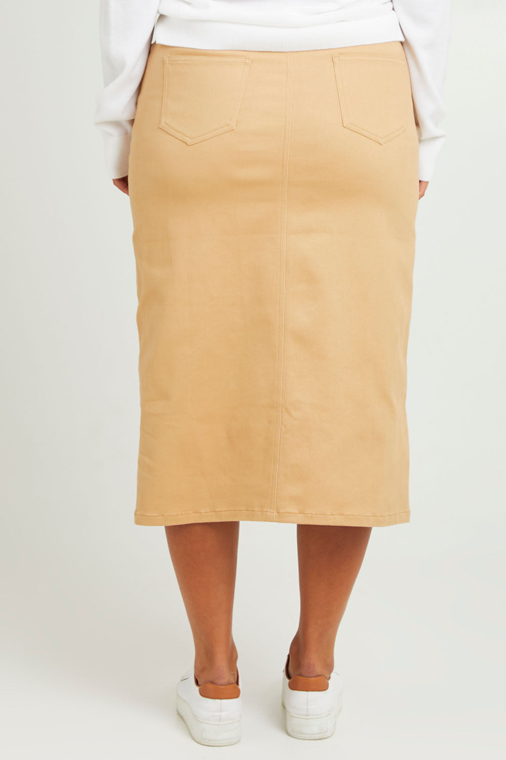 Model Monique wearing size 14 of The 5 Pocket Denim Midi Skirt in colour Tan, from the back