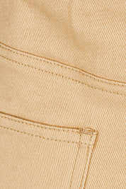 Product shot of The 5 Pocket Denim Midi Skirt in colour Tan, detail