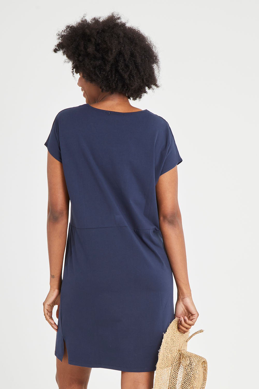 Model Aiyana wearing size 10 of The Luxe Cotton Tee Dress in colour Navy (Blue), from the back