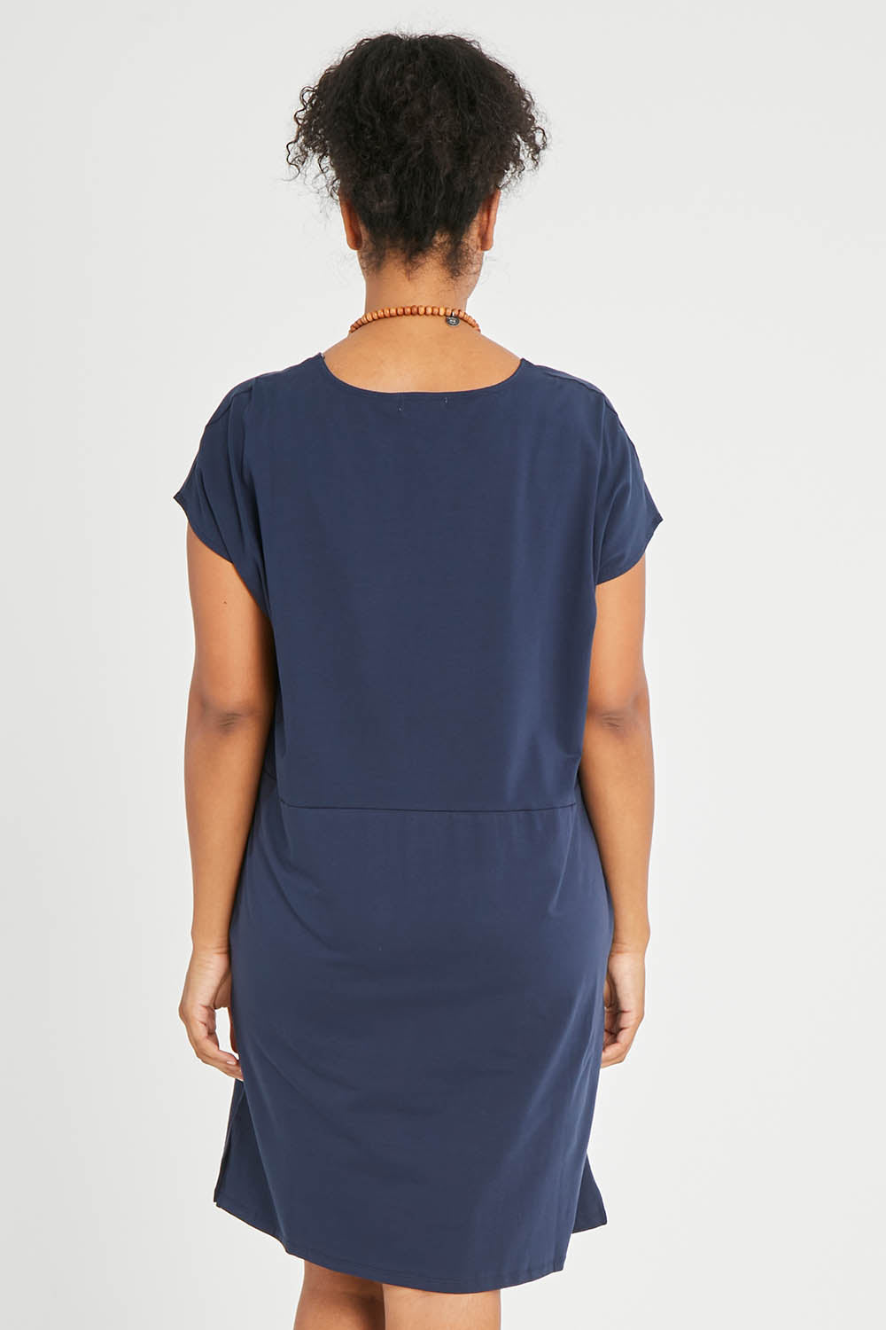 Model Noli wearing size 14 of The Luxe Cotton Tee Dress in colour Navy (Blue), from the back
