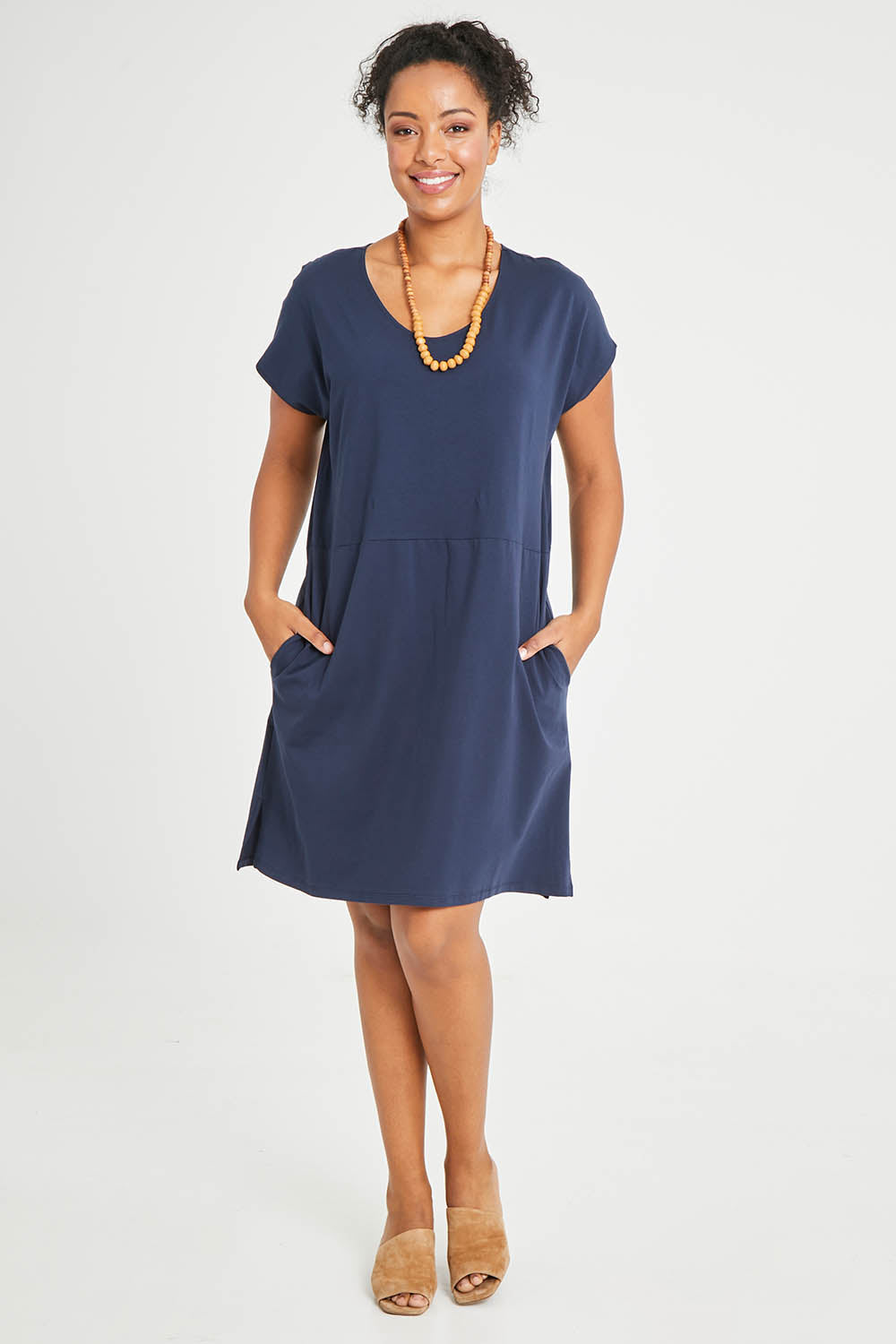Model Noli wearing size 14 of The Luxe Cotton Tee Dress in colour Navy (Blue), from the front, showing the whole outfit