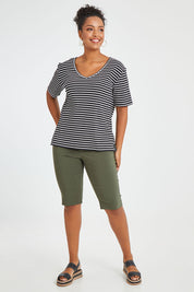 Model Noli wearing size 14 of The Keepers V Neck Striped Rib Tee in colour Black (Black), from the front, showing the whole outfit