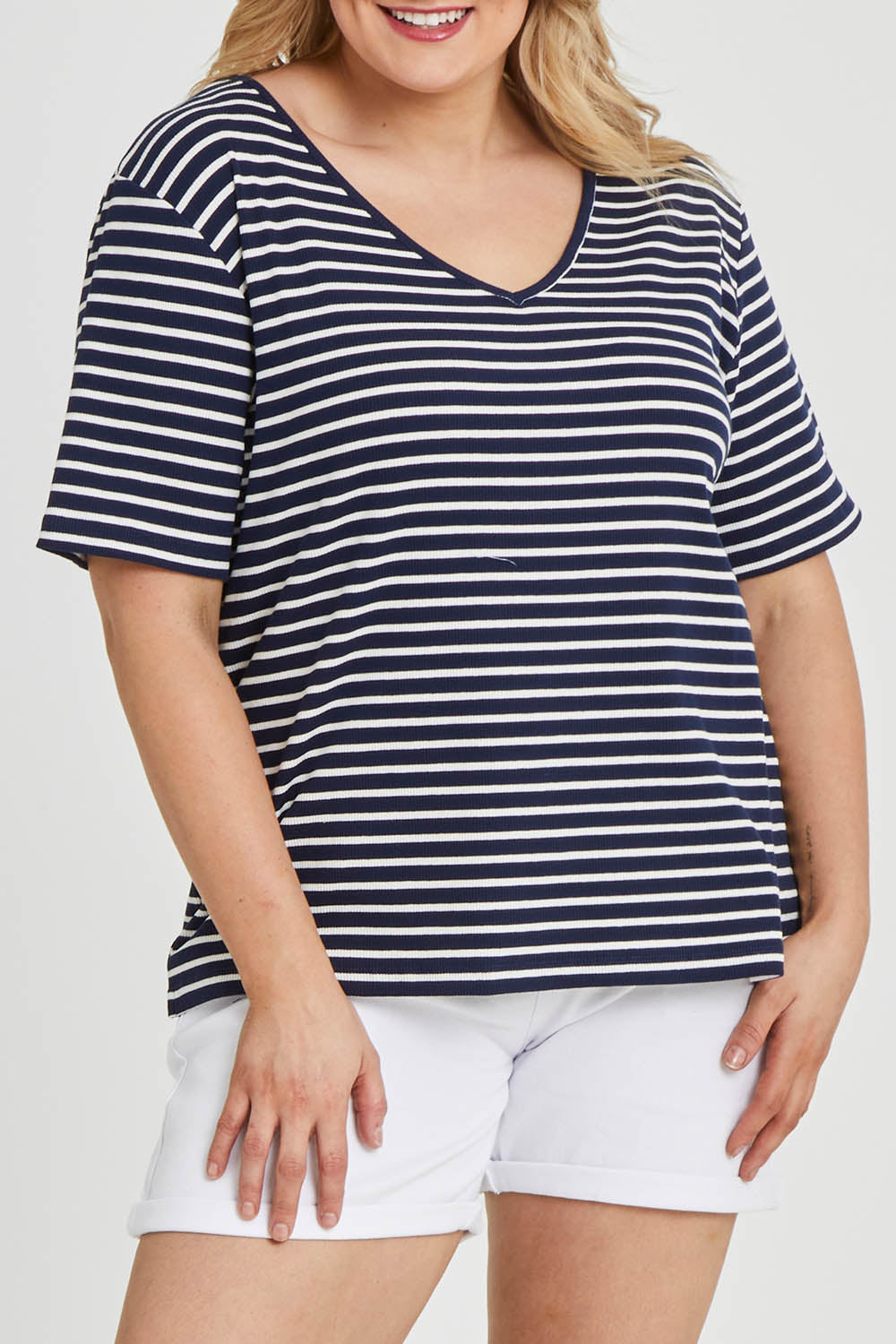 Model Keeara wearing size 16 of The Keepers V Neck Striped Rib Tee in colour Navy (Blue), from the front, cropped image